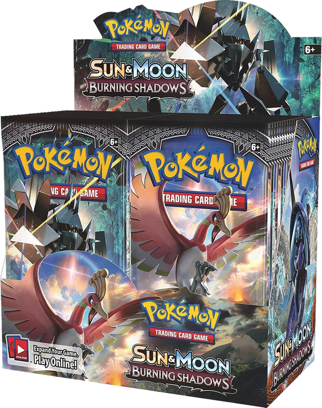 A sealed Pokemon Sun and Moon Burning Shadows booster box featuring Ho-Oh and Necrozma artwork.
