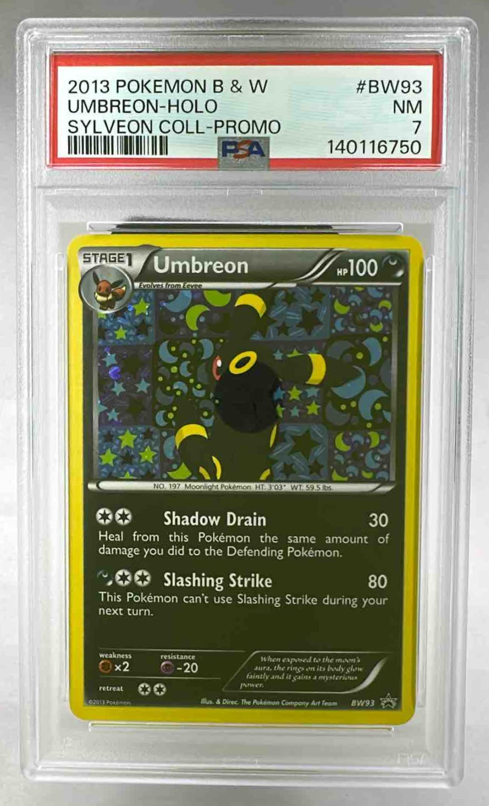 A PSA 7 graded 2013 Umbreon holographic Pokemon card from the Black and White series.