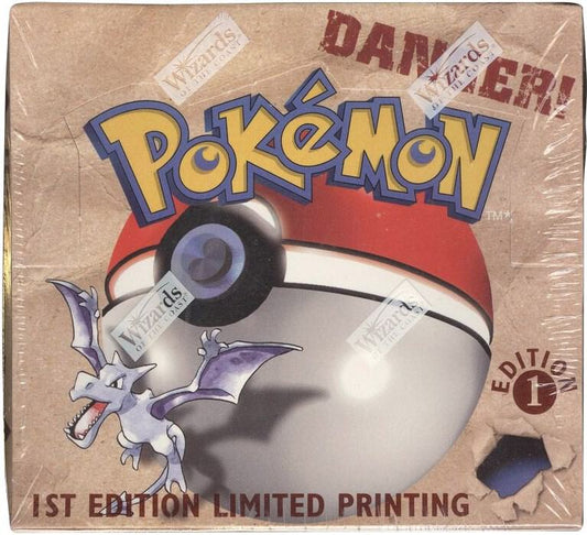 A sealed Pokemon 1st Edition Fossil booster box featuring Aerodactyl artwork.