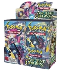 A sealed Pokemon Ancient Origins booster box featuring artwork of Hoopa and Rayquaza.