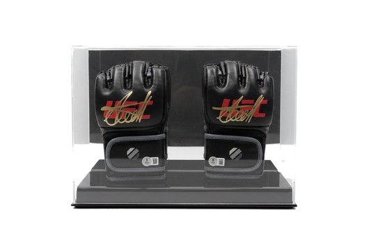 A pair of black Arman Tsarukyan signature MMA gloves displayed in a clear protective case.