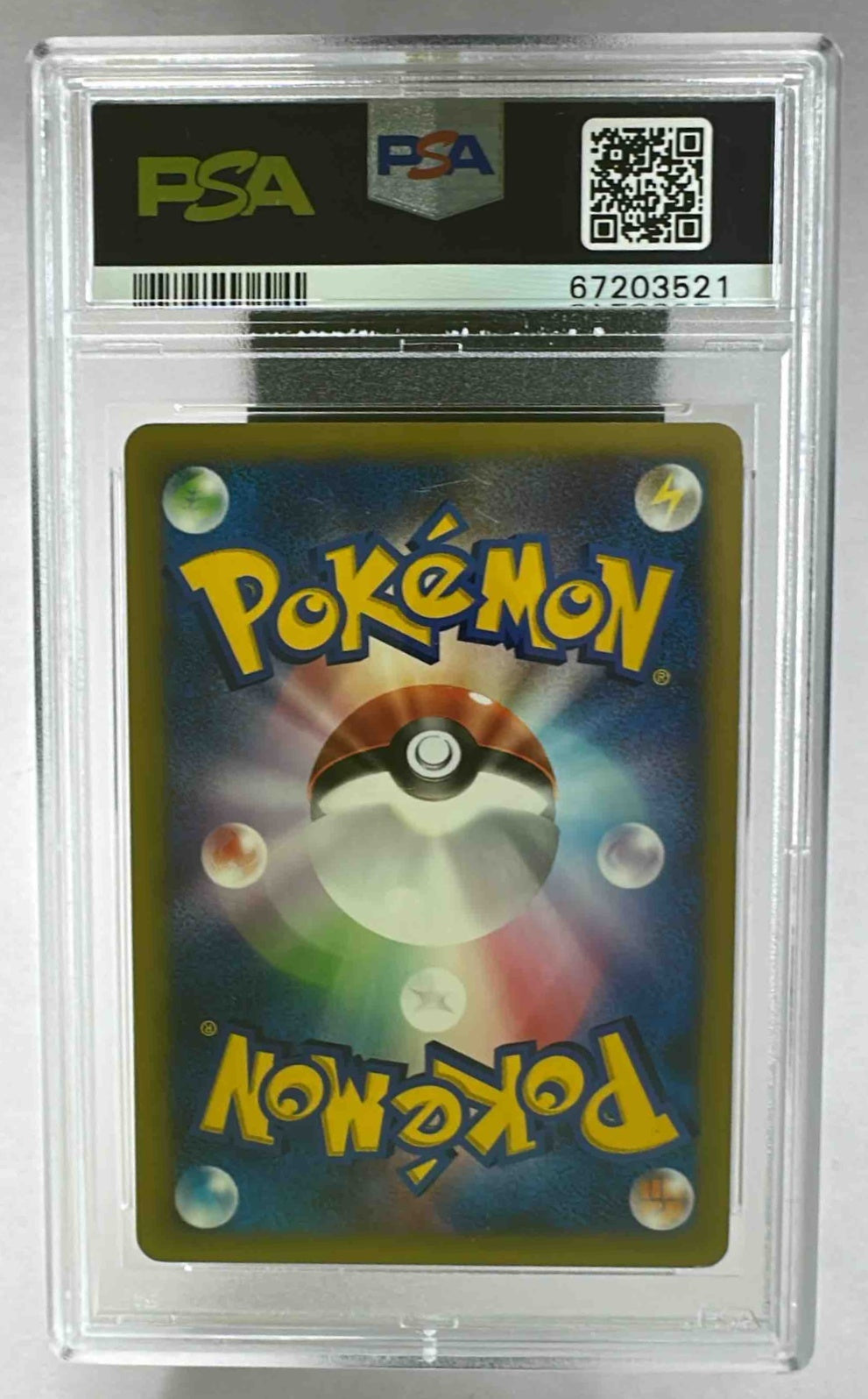 A PSA 9 graded 2001 Pokemon VS Sabrina's Espeon card in a protective plastic slab.