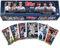 A 2025 Topps baseball complete set box featuring player imagery and sample trading cards.