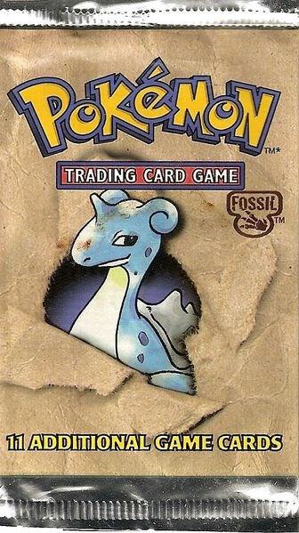 A sealed Pokemon Fossil expansion booster pack featuring an illustration of Lapras.