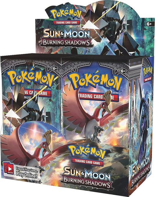A sealed Pokemon Sun and Moon Burning Shadows booster box featuring Ho-Oh and Necrozma artwork.