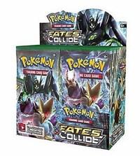 A sealed Pokemon Fates Collide booster box featuring Mega Alakazam and Zygarde artwork.