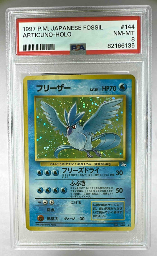 A 1997 Japanese Fossil Articuno holographic Pokemon card graded PSA 8 in a protective slab.