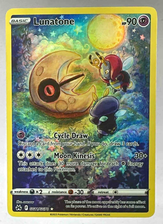 A Lunatone Pokemon card from the Crown Zenith Galarian Gallery set with artistic illustration.