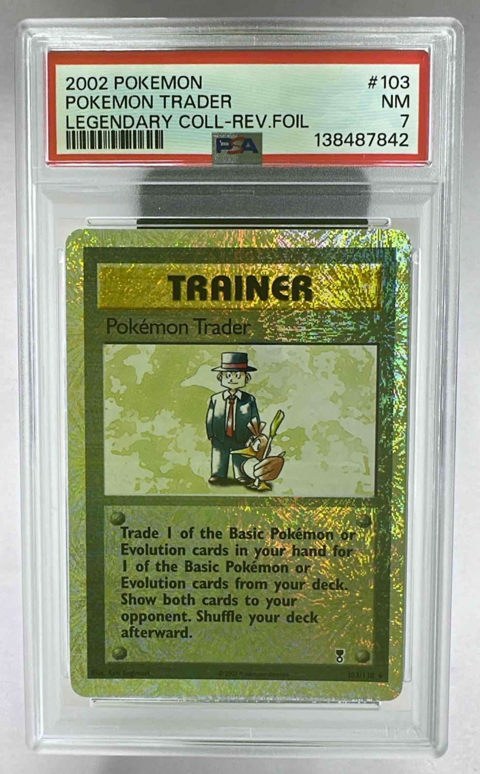 A PSA 7 graded 2002 Pokemon Legendary Collection Pokemon Trader reverse holo card.