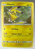 A holographic Pikachu Pokemon card from the Sun and Moon Black Star Promos set numbered SM98.
