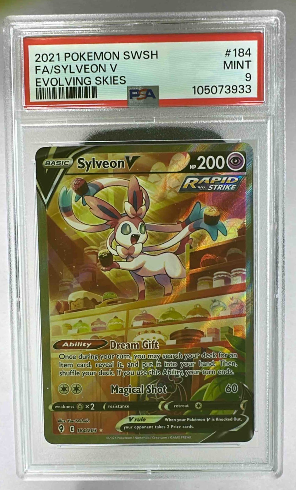 A PSA 9 graded Sylveon V full art Pokemon card from the Evolving Skies expansion.