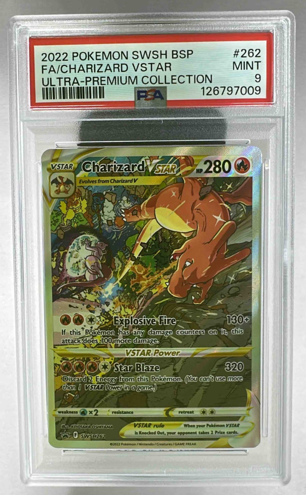 A PSA 9 graded Charizard VSTAR Pokemon card from the 2022 Black Star Promos set in a slab.