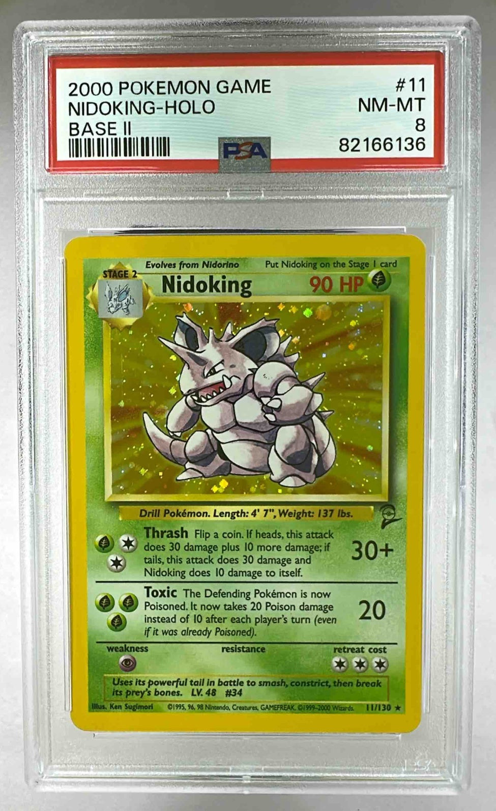 A PSA 8 graded 2000 Pokemon Base Set 2 Nidoking holographic trading card in a protective slab.