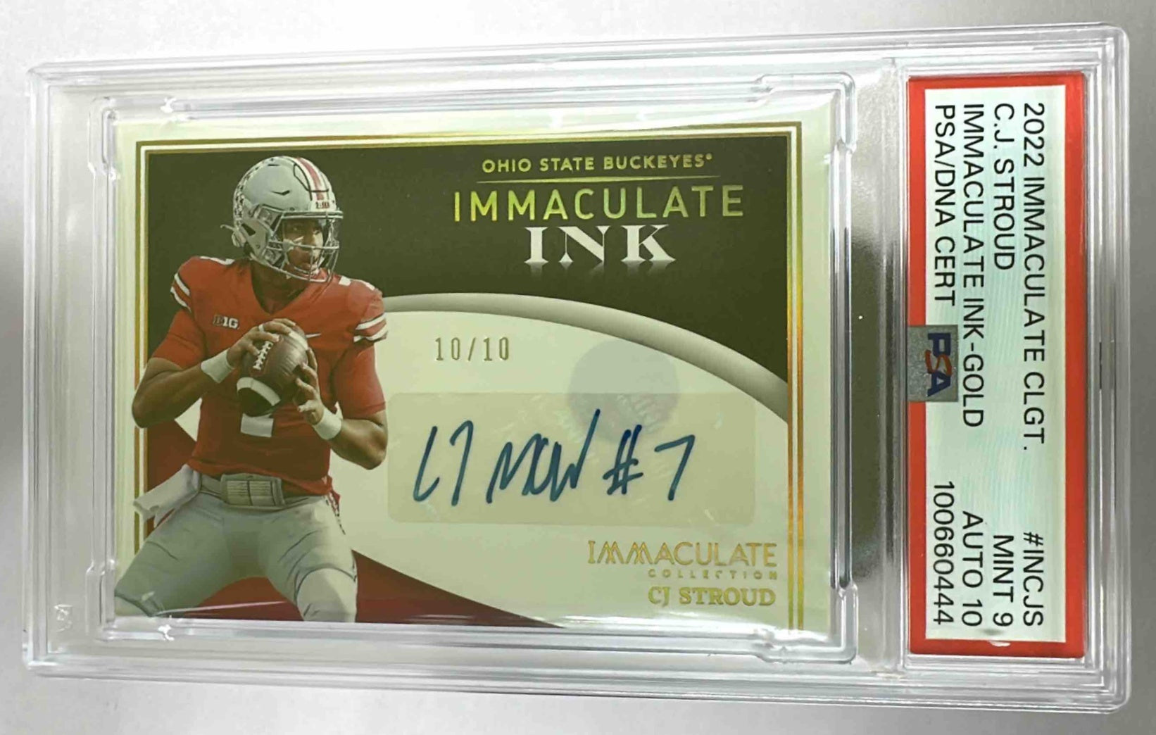 A 2022 C.J. Stroud Immaculate Ink Gold football card graded PSA 10 in a protective slab.