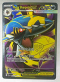 A Mega Sharpedo ex Pokemon trading card with dark blue and yellow artwork.