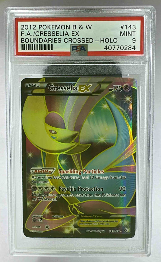A PSA 9 graded 2012 Pokemon Boundaries Crossed Cresselia holographic trading card in a slab.