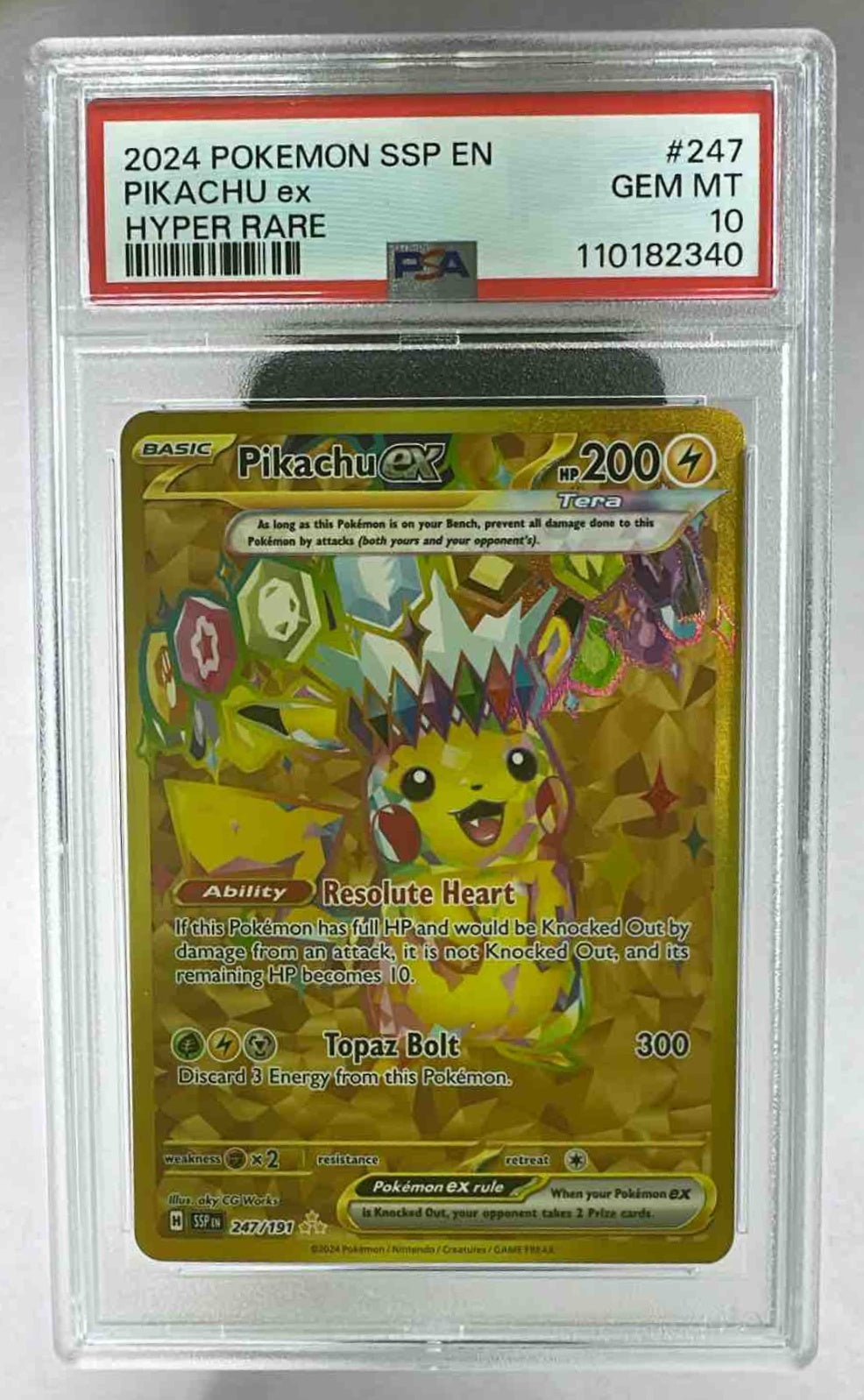A PSA 10 graded Pikachu ex gold hyper rare card from the 2024 Pokemon Surging Sparks set.