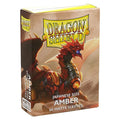 A box of 60 Dragon Shield Japanese size matte card sleeves in an amber color.